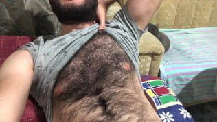 I’m getting ready to masturbate by stroking my hairy body