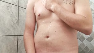 Brazilian Shower Stall Sucks: Hung Stud Shows Off Hard Cock for Gay Blowjobs